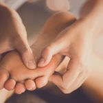 Person receiving foot reflexology at Elixir Mind Body Massage