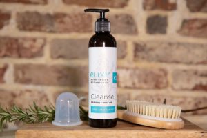 Elixir Mind Body Botanicals Cleanse massage and body oil with dry brush and cup