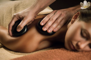 Woman enjoying hot stone enhancement