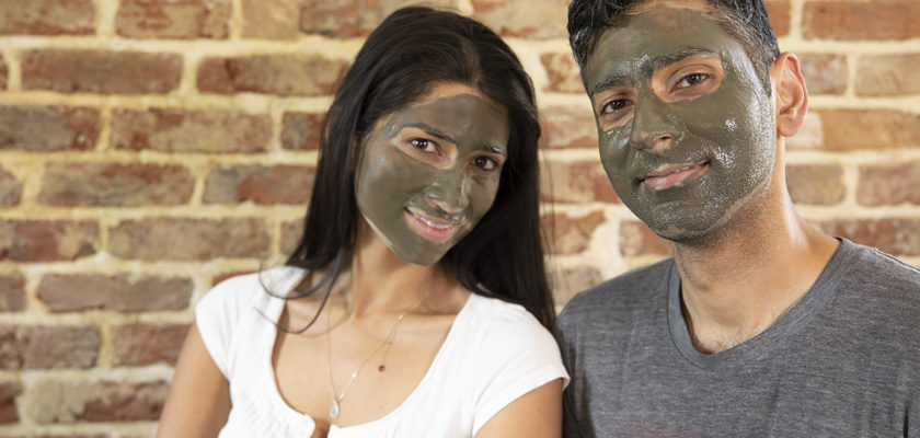 Woman and man with Elixir Mind Body Botanicals mud mask