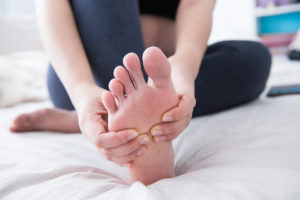 Massaging own feet
