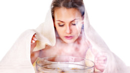 Woman steaming her face over bowl