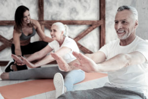 mature couple practicing yoga together