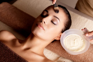 Woman getting enzyme peel facial