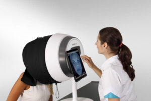 OBSERV 320 being used by esthetician to get facial analysis photos for client