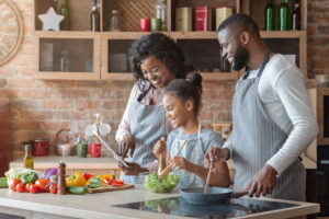 family cooking healthy food together