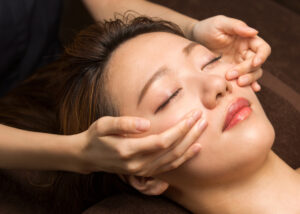 woman getting relaxing facial massage