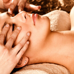 Woman getting facial massage at Elixir Mind Body Massage