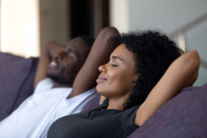 Couple relaxing at home together