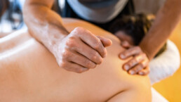 Male Massage Therapist Using Deep Tissue Massage Techniques