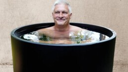 mature man in black cold plunge at Elixir Mind Body Massage