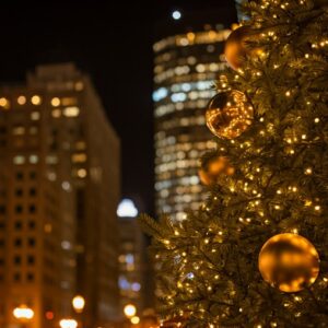 Gold Christmas tree in the foreground of downtown Denver