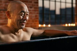 Man at Elixir Mind Body Massage in the cold plunge