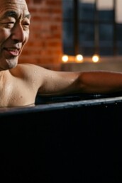 Mature man enjoying the cold plunge at Elixir Mind Body Massage