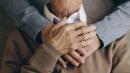 Elderly man thanking caregiver